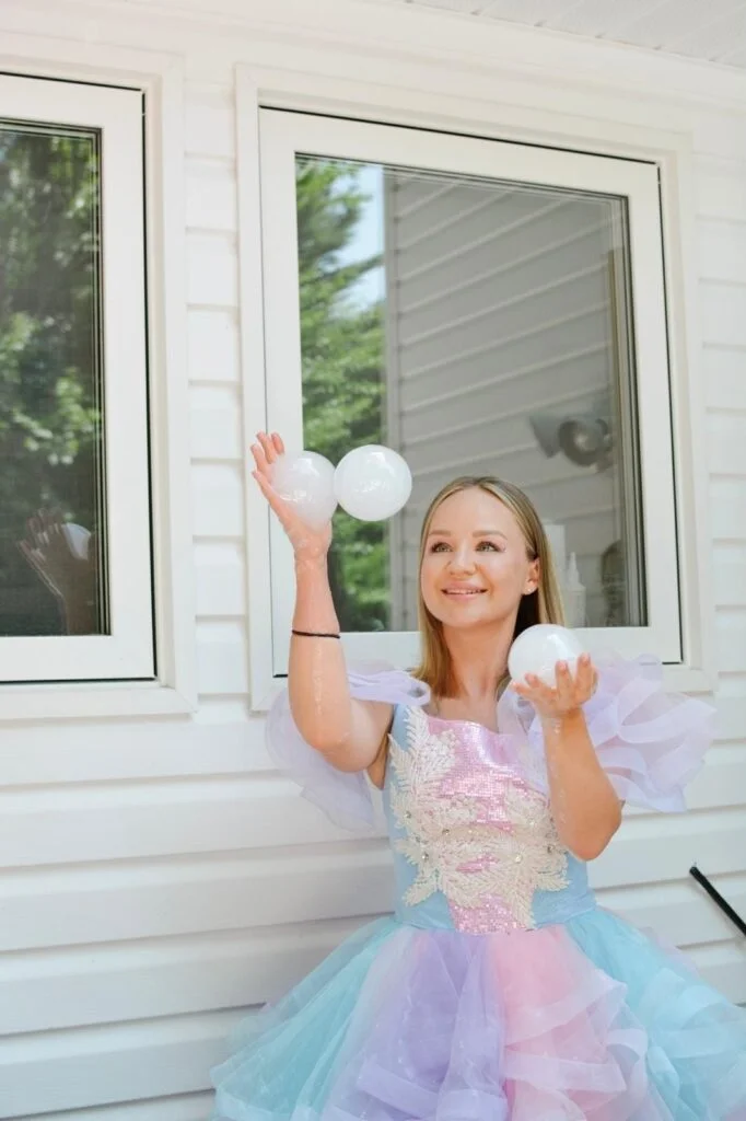 Fairy entertainer creating bubbles for children